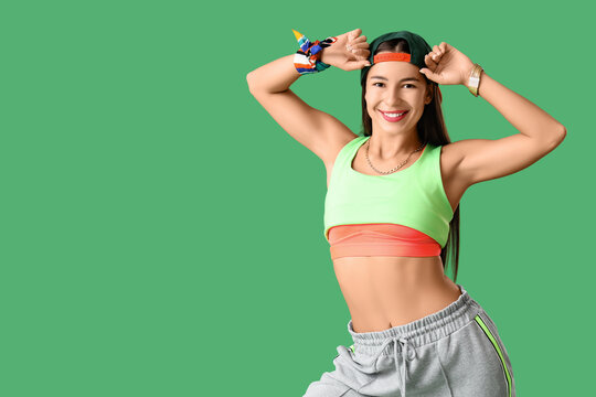 Female hip-hop dancer on green background - Powered by Adobe
