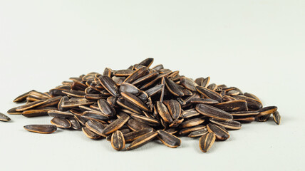 Kuaci or Kwatji is a typical Indonesian snack in the form of dried and salted sunflower seeds.
