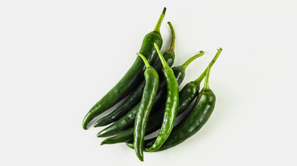 Close up of isolated fresh green chili pepper on white background
