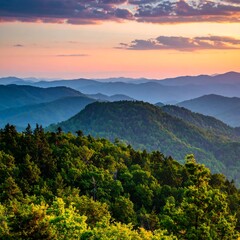 Obraz premium A breathtaking vista of layered mountain ridges under a colorful sunset