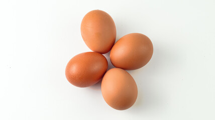 Group of brown raw eggs isolated white background
