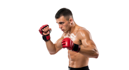 Determined mixed martial arts fighter in offensive stance isolated