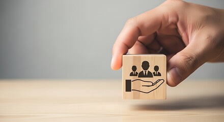 Human Resources Support Hand Holding Block with People Icons for HR Assistance