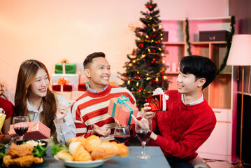 Enjoy the holiday spirit with a joyful Christmas celebration featuring friends, festive food, Santa hats,