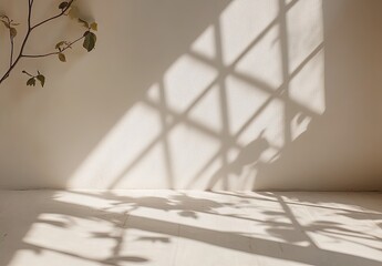 Shadowed wall, branch. Warm, neutral tones and light