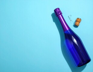 Overhead shot of a glossy blue bottle with a purple top and cork