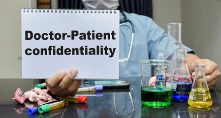 A laboratory technician highlights doctor patient confidentiality on a book. scientific research...