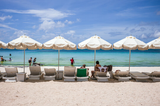 Umbrellas and lounge chairs on the beach, Boracay, Philippines