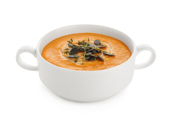 Pot of delicious pumpkin cream soup with seeds and herbs isolated on white background, closeup