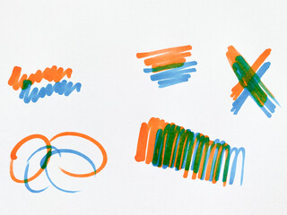 Vibrant marker scribbles showing orange and blue blending to make green.