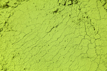 Powdered matcha tea as background, closeup