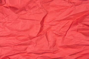 Red recycled paper texture as background, Red crumpled paper texture, Rectangular crumpled red paper sheet.