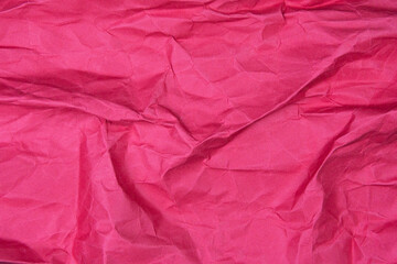 Red recycled paper texture as background, Red crumpled paper texture, Rectangular crumpled red paper sheet.