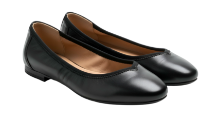 Pair of classic black leather slip on flat shoes displayed against a dark background