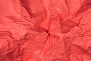 Red recycled paper texture as background, Red crumpled paper texture, Rectangular crumpled red paper sheet.