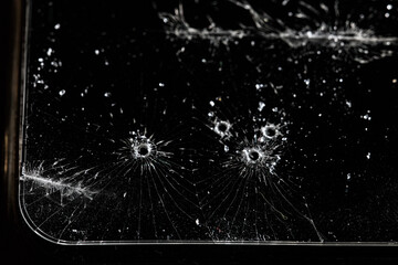 broken glass cracks on smartphone screen on black