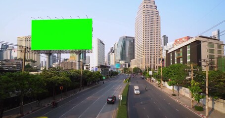 Billboard green screen on sky background advertising on the modern building near speed highway, urban view, timelapse of traffic
