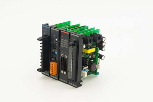 A side view details of programmable logic controller with multiple expansion modules isolated on white background