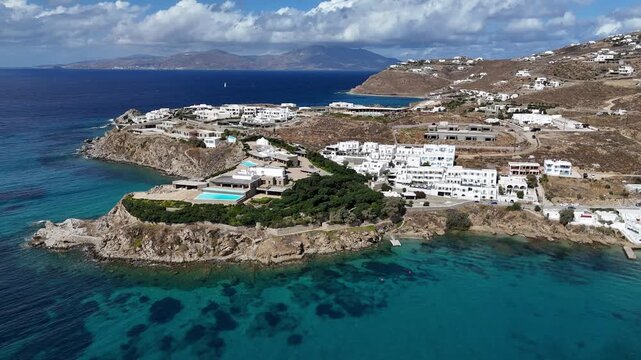 sunny clear blue coastal enclave of Mykonos, Greece, home of the rich and famous