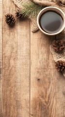 Warm dark beverage in a white cup with pine cones and pine needles on rough burlap fabric, set on rustic weathered wood table.