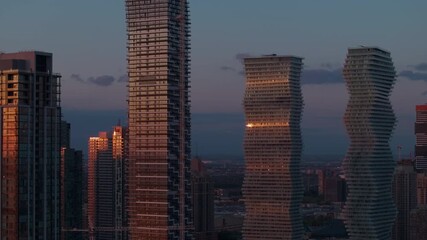 Sunset view of Mississauga's M City Condos skyline, urban serenity - Powered by Adobe