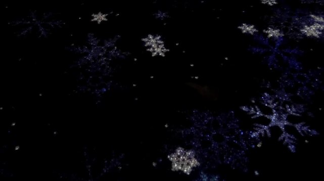 Sparkling snowflakes twinkle on a dark background, creating a festive mood