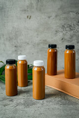 Three coffee bottles arranged neatly on textured tabletop.