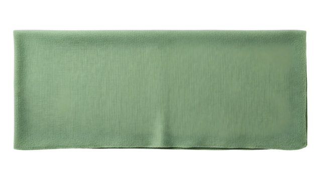 Rectangular piece of soft light green fabric lies flat against a solid black background