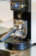 Portafilter from a coffee machine in the process of making espresso