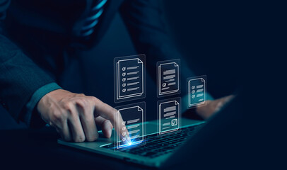 Businessman using laptop with virtual digital documents and checklist icons, representing data management, workflow automation, and paperless office technology in modern business environment.