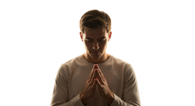 Man in contemplative prayer with glowing light on a clean background