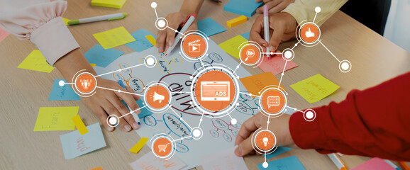 Creative business team brainstorming about marketing strategy and business plan by using mind...