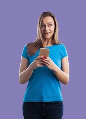Excited young woman hold smartphone, looking amazed