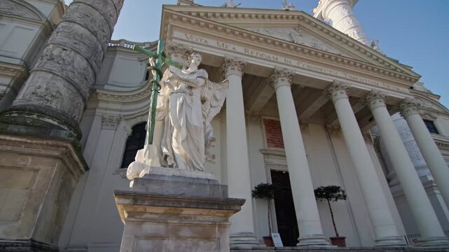 Tourist urban cityscape Karlskirche Vienna in Austria. Beautiful historical architecture statues near the church.