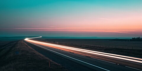 Long exposure of a highway at sunset with light trails.