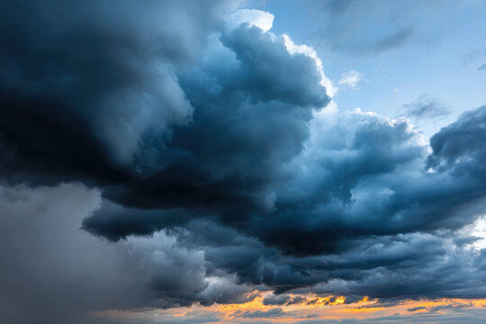 Thunderstorm clouds darkening evening countryside