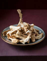 Plate of Dried Chanterelle Mushrooms on Dark Surface.
