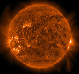 An active sun showing intense solar flares and complex coronal loops during a period of high solar activity.