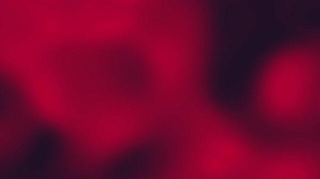 Vibrant, dark red gradient abstract background video. Smooth, slow-motion blur with black accents. Perfect as a moody overlay, stylish backdrop, or seamless looping texture for luxury, romance