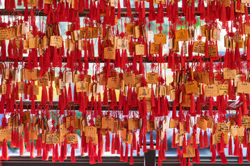 Wall of Japanese Ema Prayer Plaques with Red Tassels