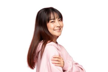 Asian Young woman smiling in pink hoodie with long brown hair and fringe, relaxed pose and warm expression
