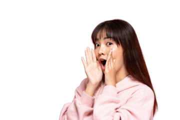 Asian young woman surprised expression whispering with hands near mouth wearing pink hoodie excited emotional portrait