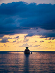 Fishing boat in the sea at sunset. Beautiful seascape.