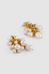 Elegant pearl cluster earrings with golden chains luxury fashion accessories product photography