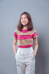 Smiling Asian Woman in Colorful Shirt Looking Confident