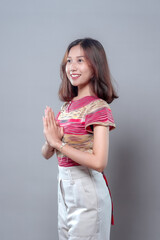 Side View of Smiling Asian Woman with Respectful Greeting Pose