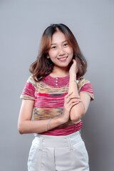Smiling Asian Woman with Confident and Cheerful Expression