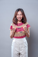 Confident Asian Woman Smiling with Excited Gesture