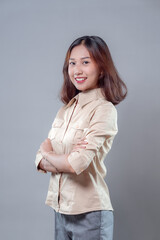 Confident Asian Woman Smiling in Business Casual Outfit