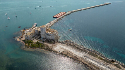 Fototapeta premium Aerial view of La Colombaia, also known as Torre Peliade or Castello di Mare. It is a medieval fortress, with a tower, located on a small island in the bay of Trapani, Sicily, Italy.